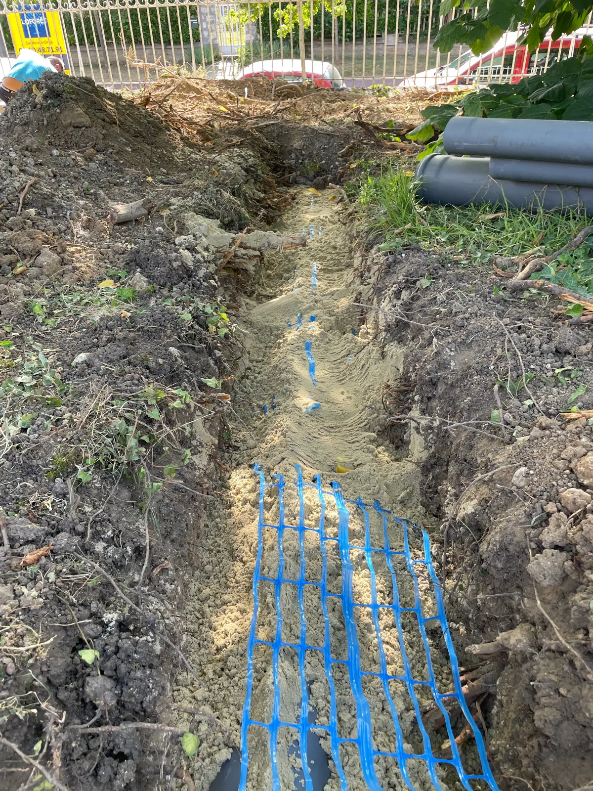 Pose d'un drainage avec géotextile sur un terrain en Essonne